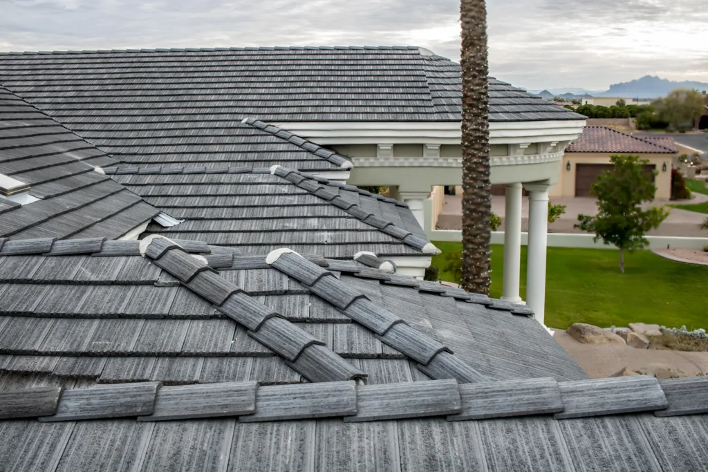Roofing Contractor in Phoenix, AZ Repairing Flashing Where a Patio Roof Meets a Home